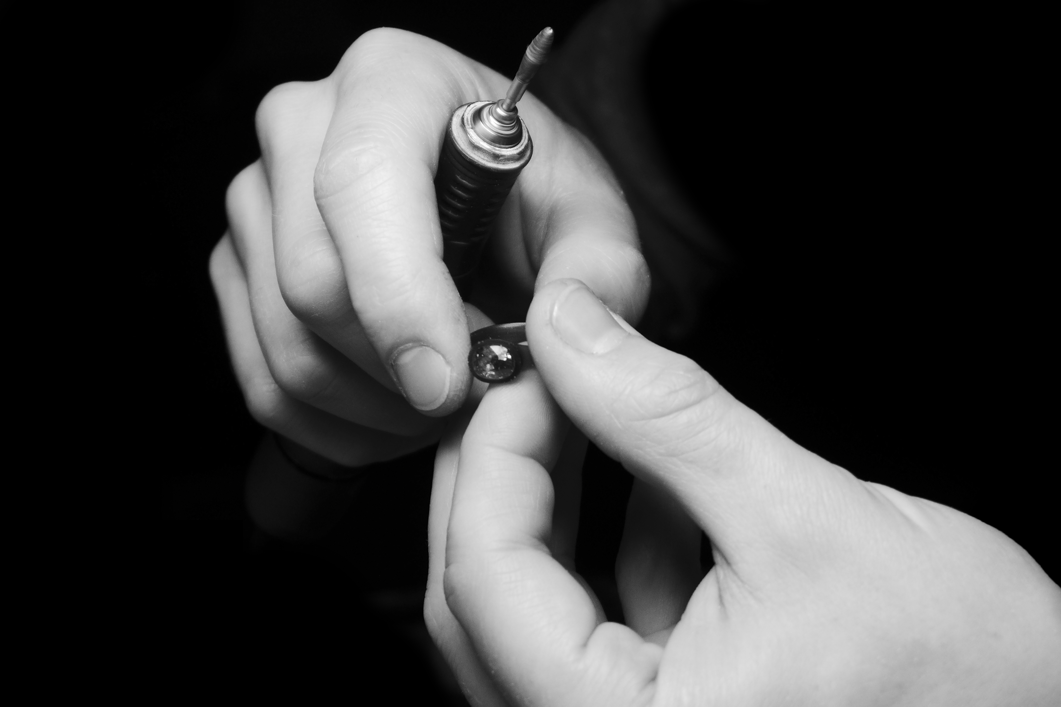 process of carving a wax model for a ring with a sapphire